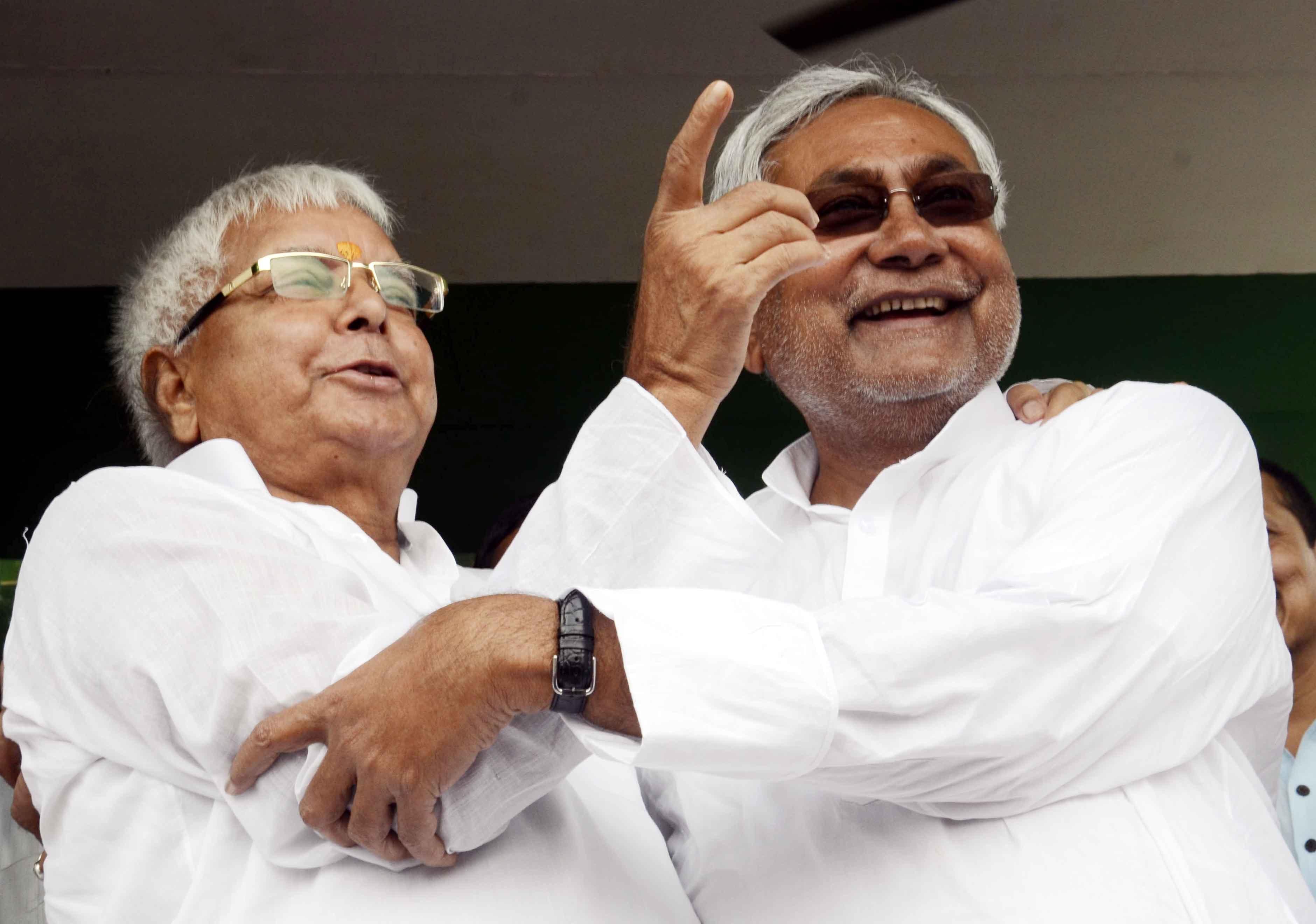 Former Chief Ministers of Bihar, RJD chief Lalu Prasad Yadav and JD-U leader Nitish Kumar during a rally in Hajipur of Bihar on Aug 11, 2014. (Photo: IANS)