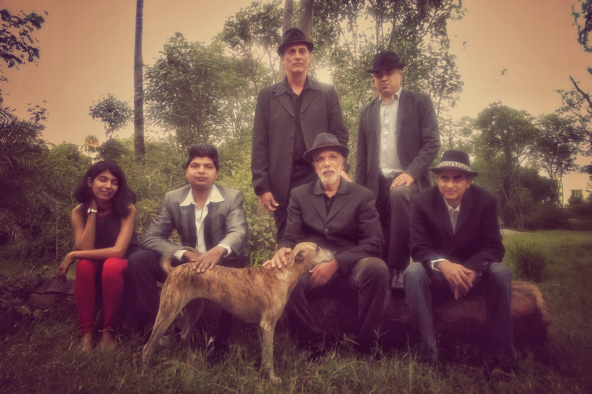 Front row, from left to right singer Rajni Shivaram; drummer Shreyas Sel; a Hoskote hound called Kutti; lead guitarist Peter Isaac; and Raveen Panday, keyboards. Back row, from left to right, Owen Bosen, electric bass; and Mukut Chakravarti, additional keyboards