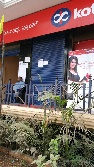 Kotak Mahindra Bank ATM. Notice the shutters completely down and the guard outside.